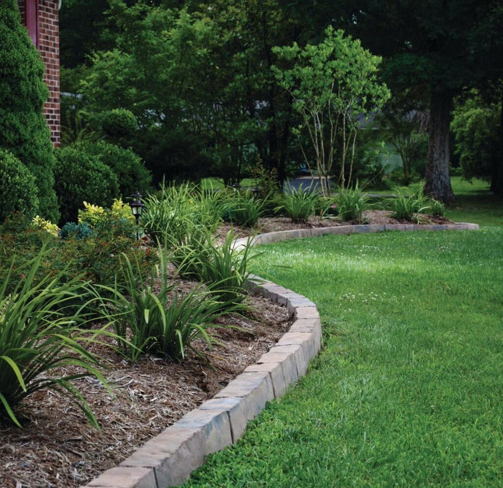 Landscape feature separation with stone edging